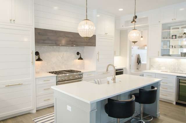 an all-white shaker-style kitchen inside a modern house
