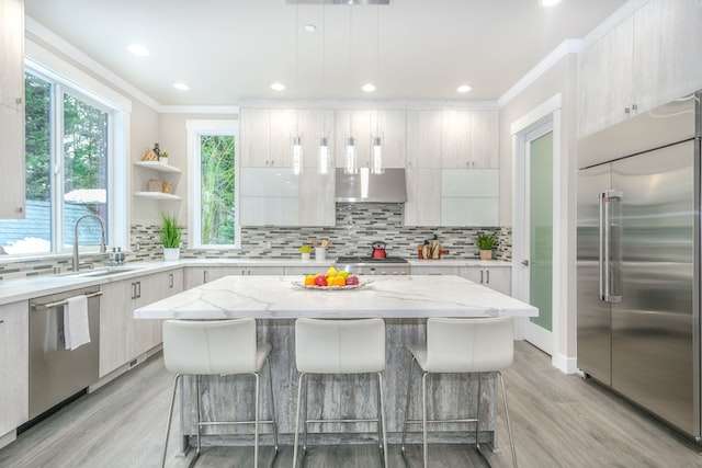 a modern kitchen with white wooden table and chairs